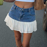 Women's Y2K two-tone denim tiered mini skirt.